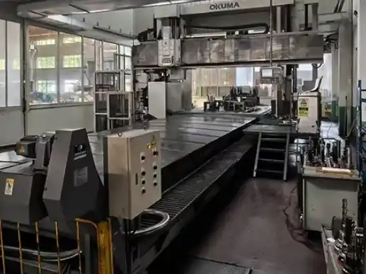 A rotary-head machine tool situated on the workshop floor